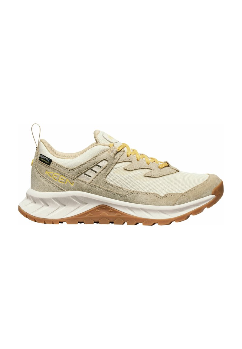 Beige Sportschuh aus Mesh- und Wildledermaterialien, mit gelben Akzenten, strukturiertem Schuhsohle und gepolsterter Zwischensohle. Verfügt über eine Zuglasche.