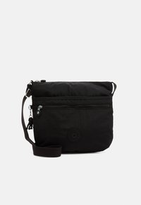 Borsa a spalla nera in nylon con tasca frontale con zip, tracolla regolabile e dettaglio logo circolare. Texture morbida e design compatto.