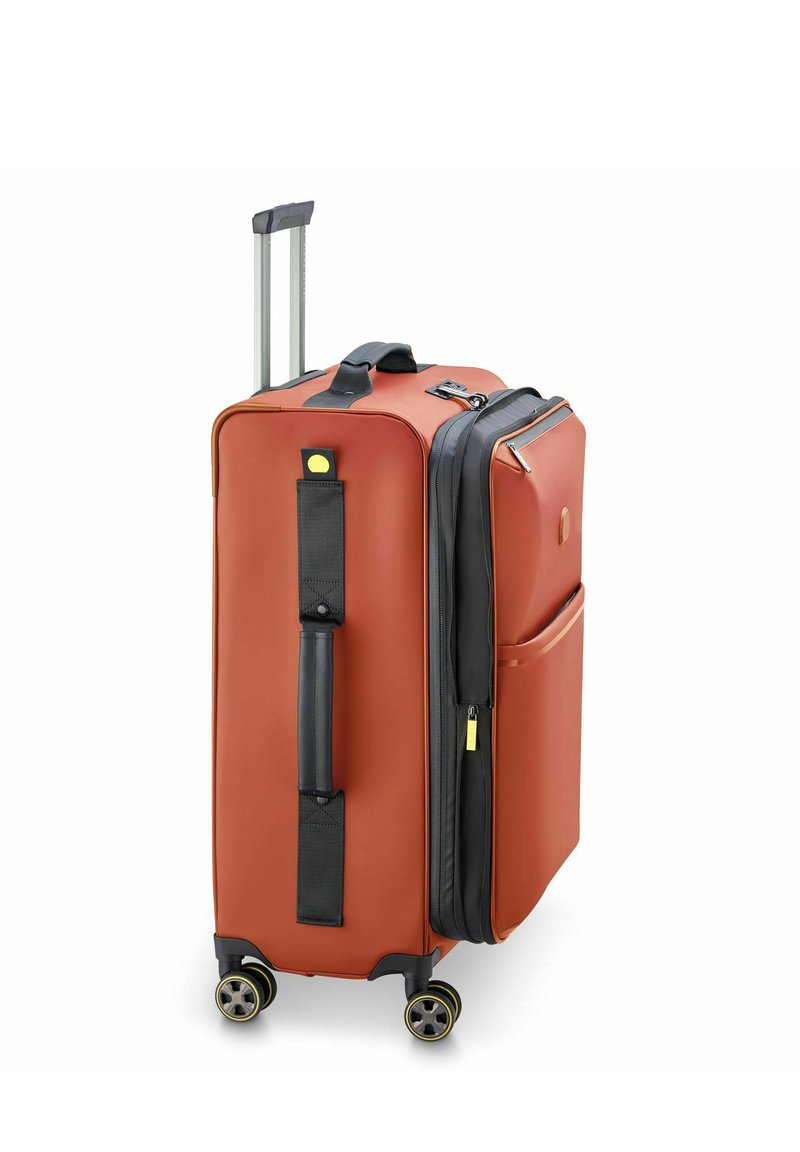 Hartschalenkoffer in verbranntem Orange mit einem schwarzen Reißverschluss, doppelten Rollen, ausziehbarem Griff und Seitentasche für zusätzlichen Stauraum.