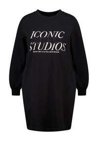 Robe sweat-shirt noire à manches longues, ornée d'une inscription blanche "ICONIC LOVE STUDIOS" embellie de paillettes, avec un col rond.