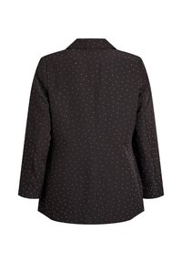 Schwarzer Blazer mit weißen Punkten, langen Ärmeln, Reverskragen und taillierter Passform. Strukturierter Stoff mit glatter Oberfläche und belüftetem Rücken.