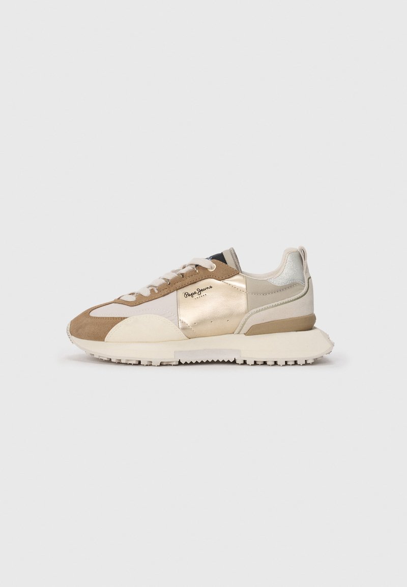 Sport sneakers featuring a mix of beige, gold, and cream materials, with a textured surface and a thick, white rubber sole.