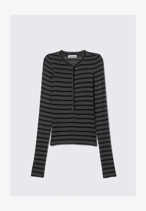 Svart og gråstripet langermet topp med rund hals og knappestolpe foran. Mykt stoff med figursymmetrisk design.