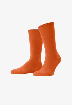 Orange Crew-Socken aus weichem, strukturiertem Stoff mit einem einfarbigen Design und einem gerippten Bündchen für Komfort und Passform.
