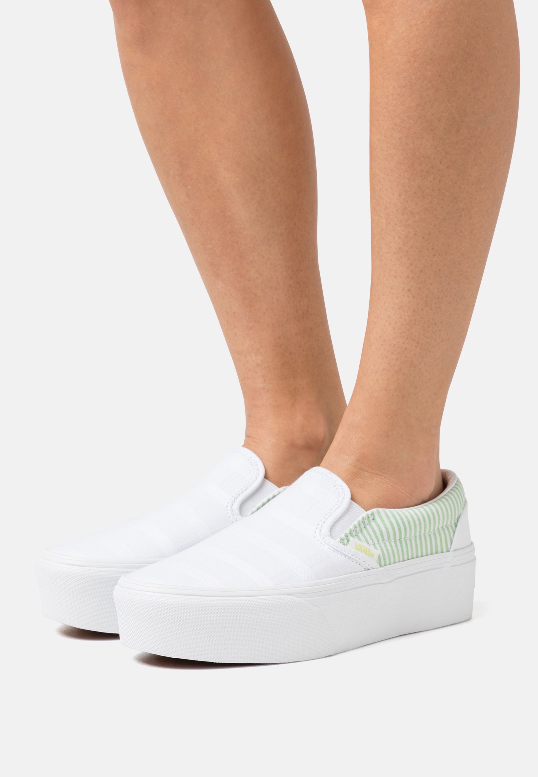 white leather slip on vans womens