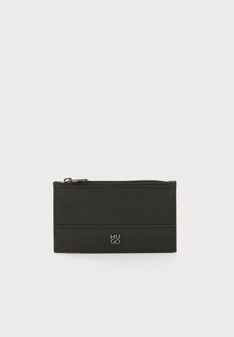 Black leather wallet with textured finish, zip closure, and embossed logo at the bottom. Compact rectangular shape with minimal design.