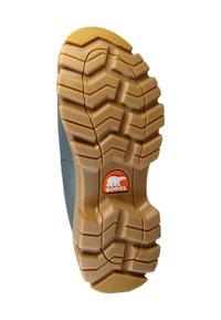 Rubberen laars zool met een gestructureerd profiel en diepe groeven, lichtbruine kleur, en een cirkelvormig oranje logo met een berenontwerp.