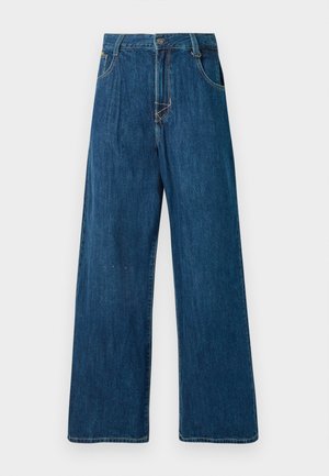 Vide benjeans i mørkeblå farge, med knappelukking, fem lommer og synlige sømdetaljer. Glatt tekstur. Ingen dekorasjoner.