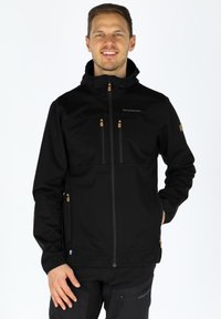 Black softshell jacket with a high collar, two zippered chest pockets, side pockets, and gold hardware accents. Smooth texture.