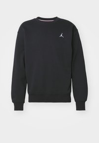 Sudadera negra de felpa con cuello redondo, mangas largas, puños y dobladillo acanalados. Presenta un pequeño logo blanco de Jordan en el pecho.
