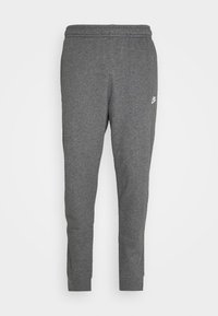 Grå bomullsjoggers med avsmalnande passform, elastisk midja och en liten vit logo vid vänster höft. Utrustad med ribbade ankle cuffs.