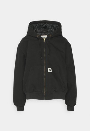 Black hooded sweatshirt with a zip-up front, elastic cuffs, a large front pocket, and a quilted interior lining. Carhartt logo patch on pocket.