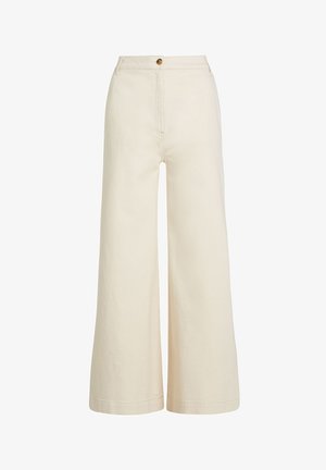 Pantalons larges en coton beige clair, dotés d'une taille haute, d'un bouton frontal unique et d'un tissu lisse et texturé.