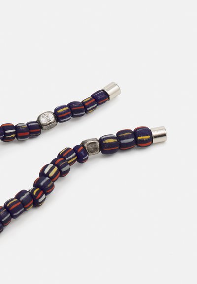 Colorful beaded necklace featuring dark blue beads with stripes in red, yellow, and silver accents, with cylindrical metal clasps.