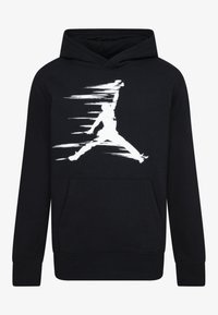 Felpa nera con cappuccio realizzata in tessuto morbido, dotata di una tasca frontale, caratterizzata da un grande logo Jumpman bianco e un design grafico dinamico.