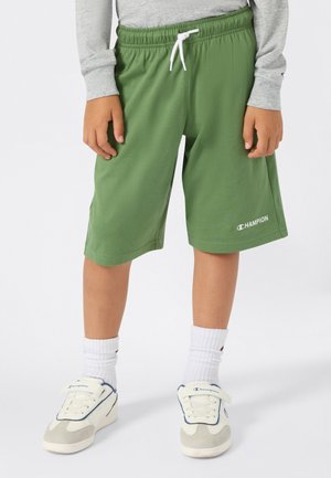 Shorts verts avec une taille élastique et un cordon blanc, dotés de poches latérales et d'un logo "Champion" blanc en bas.