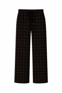 Μαύροι φαρδιοί παντελόνες με ελαστική μέση, κορδόνια και σχέδιο από μικρές χρυσές τελίτσες, ομοιόμορφα τοποθετημένες.