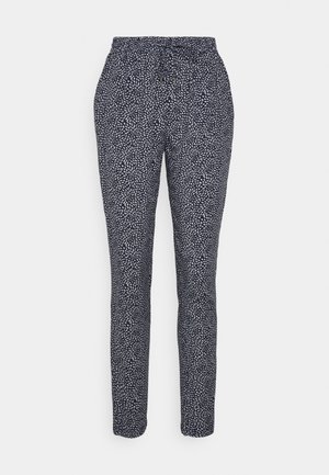 Pantalon bleu marine avec un motif abstrait moucheté blanc, taille élastique et coupe fuselée.