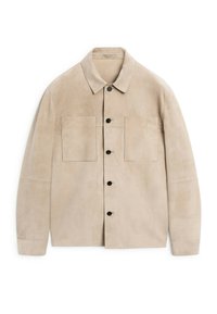 Beige suede jacket with a collared neckline, front pockets, and black buttons. Features a smooth texture and straight cut design.