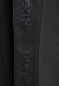 HUGO Tygbyxor - black