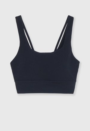 Navy blue sports bra crafted from soft material, featuring a scoop neck, wide straps, and an elastic underband for support.