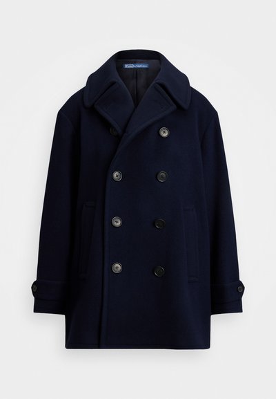 Marineblauwe wollen peacoat met een dubbelbreasted ontwerp, grote revers, zes zwarte knopen en twee zijzakken. Soepele textuur.