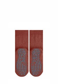 Calze di cotone rosse con suola in gomma blu antiscivolo, caratterizzate da una superficie testurizzata e un design semplice e aderente.