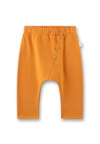 Orange Baumwollbabyhose mit elastischem Bund und drei Holzknöpfen auf der Vorderseite, lockere Passform und verkürzte Länge.