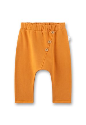 Orange cotton baby pants with an elastic waistband and three wooden buttons on the front, featuring a loose fit and cropped length.