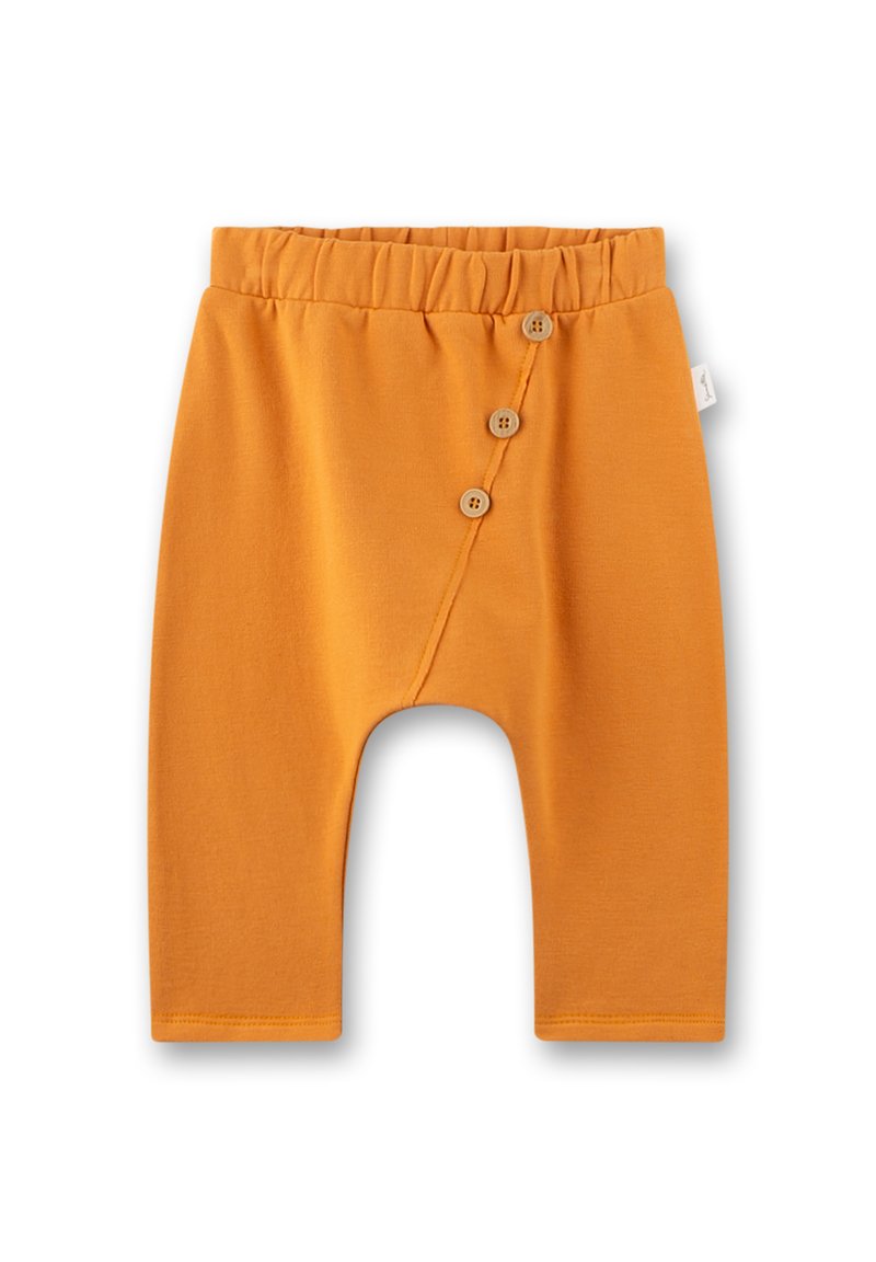 Orange Baumwollbabyhose mit elastischem Bund und drei Holzknöpfen auf der Vorderseite, lockere Passform und verkürzte Länge.