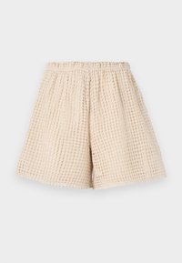 Beige shorts met een gestructureerd, wafelachtig patroon. Elastische tailleband en losse pasvorm. Lengte tot halverwege de dij. Lichtgewicht materiaal.