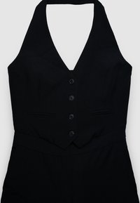 Gilet nero senza maniche con scollo americano, quattro bottoni frontali e due tasche orizzontali a fessura.