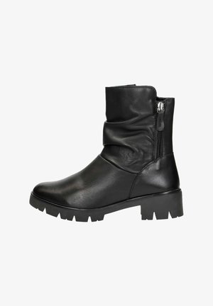 Bottines en cuir noir avec un design décontracté, fermeture éclair sur le côté, semelle épaisse et texture lisse. Convient pour une utilisation décontractée ou résistante aux intempéries.