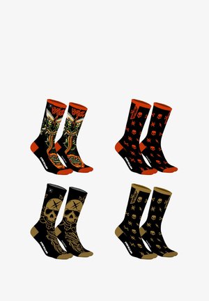 Quatre paires de chaussettes : noires avec des graphiques audacieux, des crânes et des accents orange ; une paire présente un design de crâne coloré ; matière en mélange de coton.