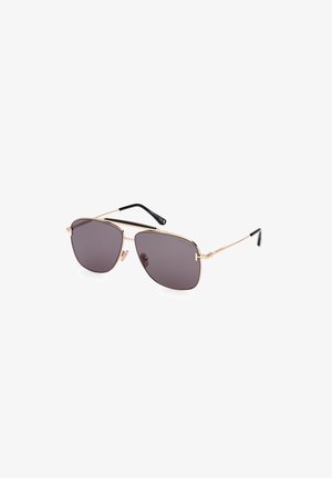 Gafas de sol estilo aviador con un marco de metal dorado y lentes oscuros, que presentan un diseño elegante y puntas de patilla negras.