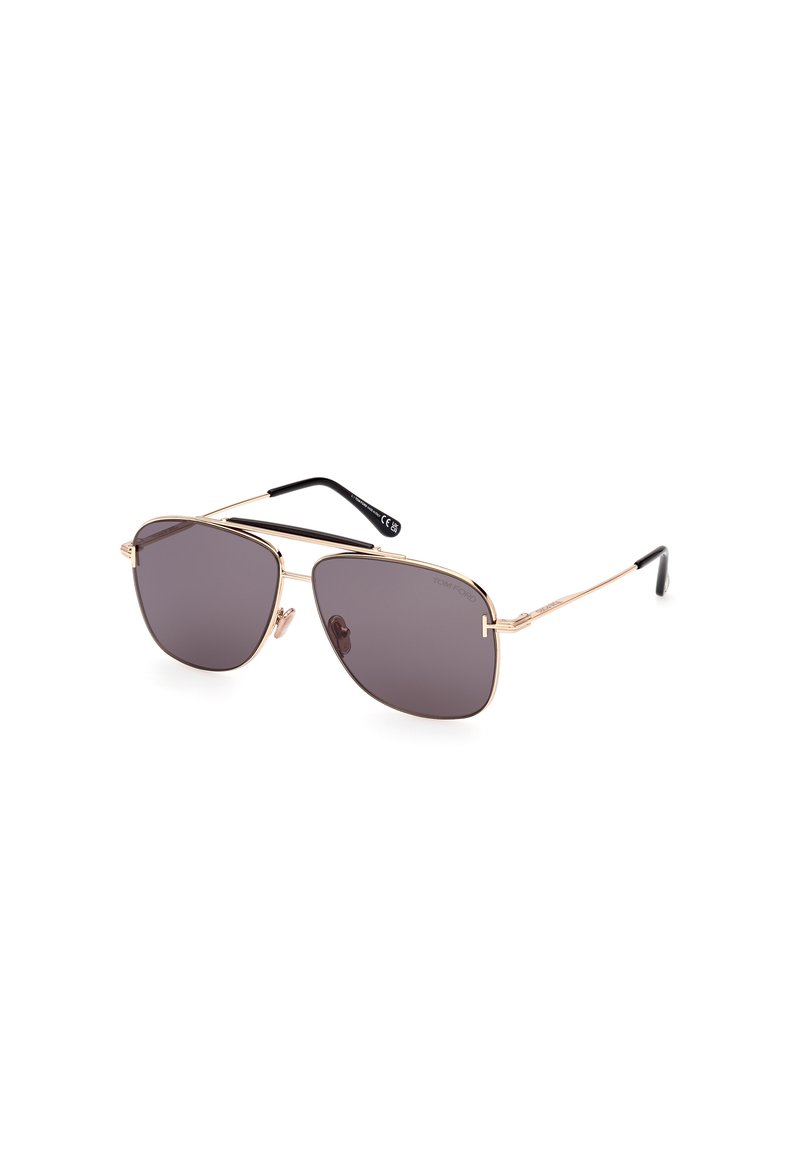Aviator sunglasses with a gold metal frame and dark tinted lenses, featuring a sleek design and black temple tips.