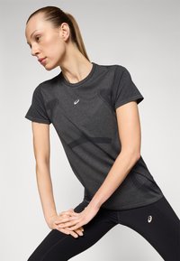 ASICS SEAMLESS TOP - T-shirt till träning - performance black/carrier grey