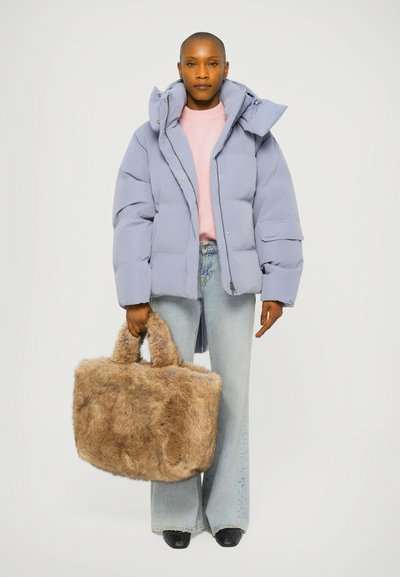 Light purple puffer jacket with a high collar, pink sweater, light blue jeans, and a brown faux fur bag with short handles. Dark shoes.