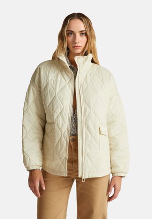 Gepolsterte cremefarbene Pufferjacke mit hohem Kragen, zwei Fronttaschen und elastischen Bündchen, ausgestattet mit einem Reißverschluss und einem dezenten Diamantmuster.