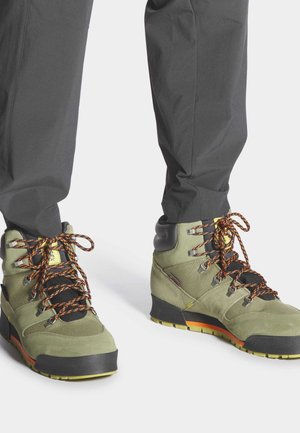 TERREX SNOWPITCH COLD RDY TRAXION - Hiking shoes - focus olive   core black   pulse olive