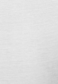 White fabric with a smooth, fine texture and subtle ribbing pattern, evenly illuminated without any visible patterns or markings.