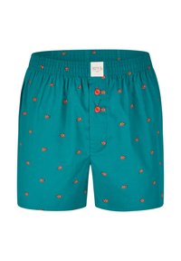 Pantaloni da nuoto turchesi con stampe di piccoli pesci pagliaccio arancioni, cintura elasticizzata e due bottoni rossi. Tessuto morbido, design casual.