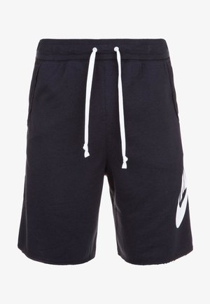Black athletic shorts with white drawstring and large white Nike swoosh logo on the left leg, featuring side pockets and elastic waistband.