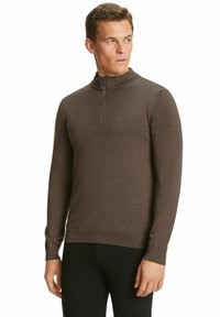 Brauner Pulli mit Reißverschluss am Hals, aus einem weichen, strukturierten Stoff. Er verfügt über lange Ärmel und ein figurbetontes Design. Schlicht und unaufdringlicher Stil.