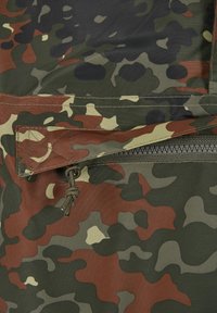 Camouflage fabric with green, brown, beige, and black patterns featuring a zipper partially covered by a stitched flap with a pull cord.