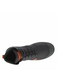 Black waterproof boot with gray laces, rubber toe cap, textured fabric, and orange logo tag on the tongue. Cushioned collar and rugged sole.