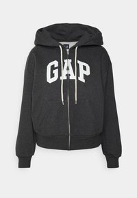 Felpa grigia con zip e logo bianco "GAP" sul davanti, con cappuccio regolabile e tasche anteriori. Tessuto morbido con polsini a coste.