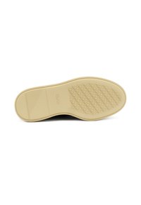 Suela de zapato negra con una suela de goma beige texturizada, que presenta un patrón geométrico y un detalle de marca embellecido en la superficie.