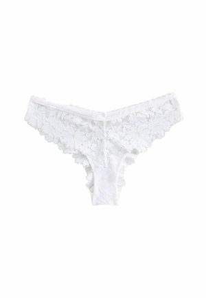 Witte kanten string met bloemenpatroon, gegolfde randen en zachte stof. Voorzien van een comfortabele tailleband en minimale bedekking aan de achterzijde.