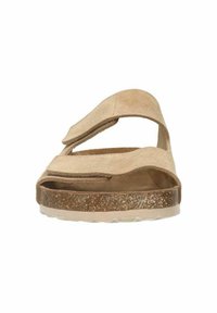 Sandali beige in suede con due cinturini regolabili, una soletta sagomata e una suola intermedia testurizzata e maculata. Design open-toe per una migliore traspirabilità.